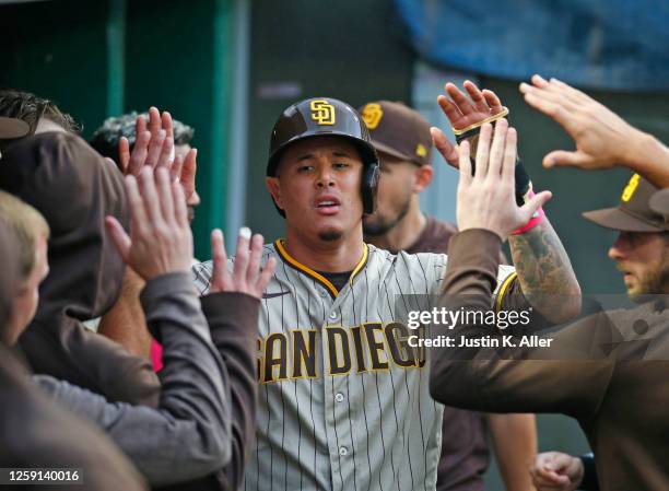 Manny Machado of the San Diego Padres celebrates after scoring on a RBI single in the second inning against the Pittsburgh Pirates at PNC Park on...