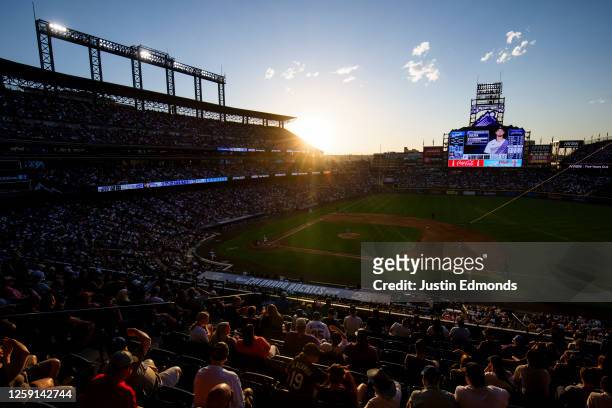 General view of the un setting behind the stadium as starting pitcher Clayton Kershaw of the Los Angeles Dodgers delivers top home plate against...