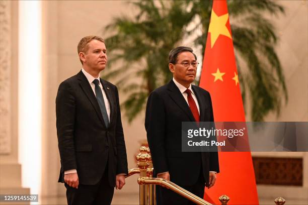 New Zealand Prime Minister Chris Hipkins and China's Premier Li Qiang attend a welcoming ceremony at The Great Hall Of The People on June 28, 2023 in...