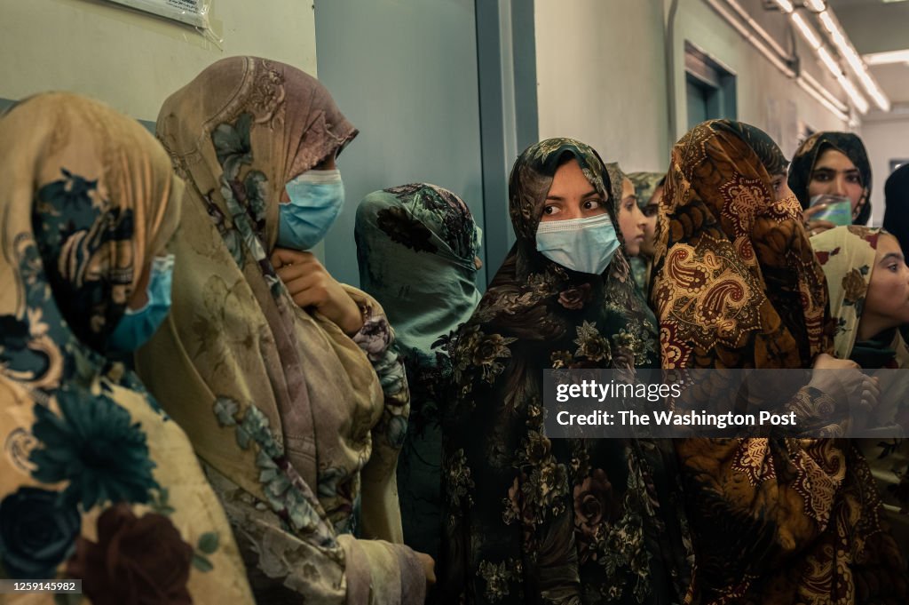 Women wait in the district hospital of Shindand, a district of Herat province, Afghanistan