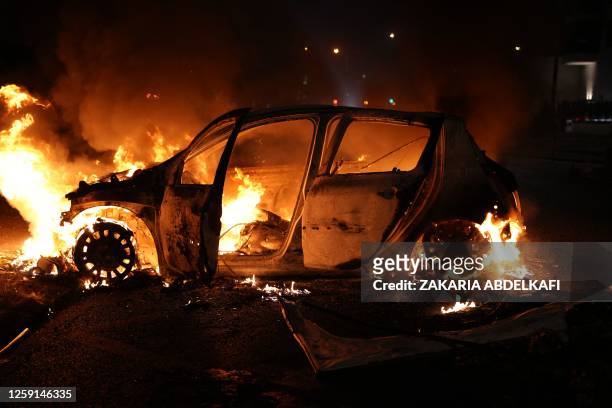 Vehicle burns destroyed during a protester in Nanterre, west of Paris, on June 27 after French police killed a teenager who refused to stop for a...