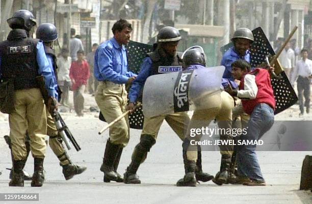 Policemen hit an opposition activist in Dhaka, 15 February 2001, during a day long nation-wide anti-government general strike. The country's four...