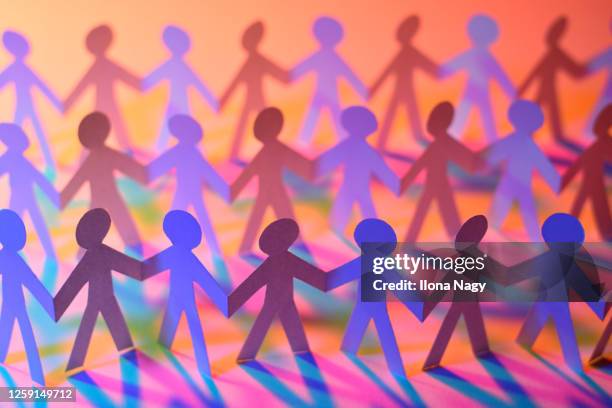 paper chain figures with colored shadows - paper person stock pictures, royalty-free photos & images