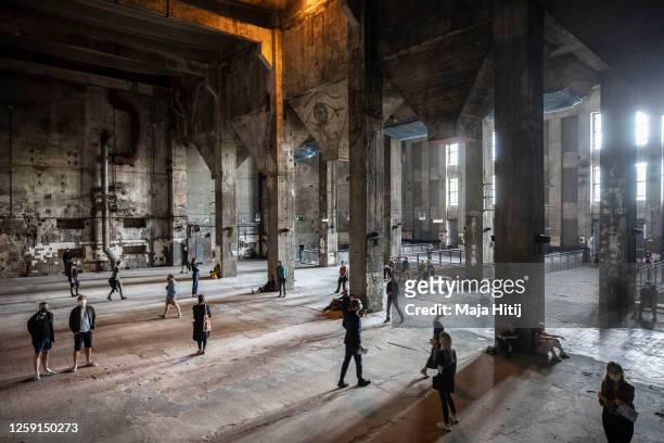 Visitors listen Tamtam’s sound installation "Eleven Songs – Halle am Berghain" at Berghain club on July 26, 2020 in Berlin, Germany. The installation...