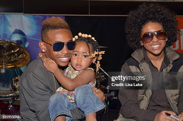 Recording artist Prodigy and Princeton pose with a fan while signing autographs at the celebration for Mindless Behavior's Girl album release with an...