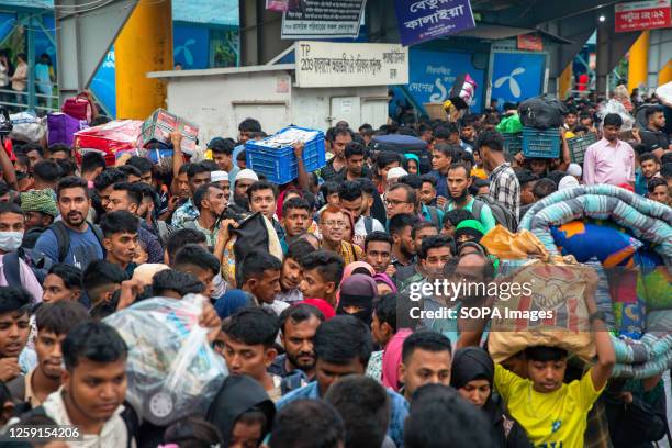 People are seen at a port in Dhaka, leaving the capital to go back to their hometowns to celebrate Eid Al Adha with their families and loved ones....