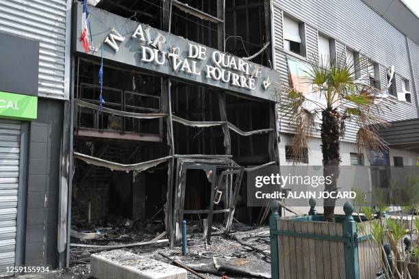 This photograph taken on June 28 shows the facade of a burnt-down annex town hall of the Le Val Fouree neighbourhood in Mantes-la-Jolie, a day after...