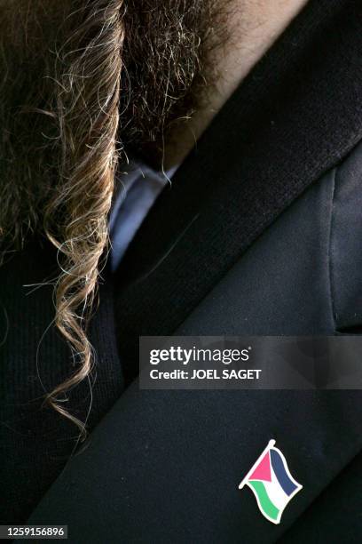 An anti-zionist orthodox rabbi wears a Palestinian flag badge as he came from United Kingdom to show his support to Palestinian leader Yasser Arafat...