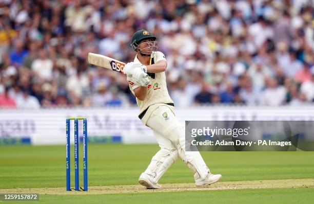Australia's David Warner hits a six to reach his 50 as he bats during day one of the second Ashes test match at Lord's, London. Picture date:...