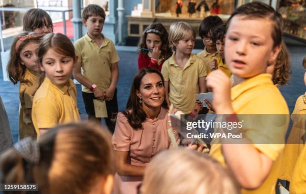 Catherine, Princess of Wales, Patron of the V&A, speaks with children of Globe Primary school in Bethnal Green as she officially opens The Young V&A,...