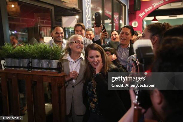 Sun Valley, CA Supporters cheer on LA City Council District 6 special election candidate Imelda Padilla, center, at her election party at Chicuagle...