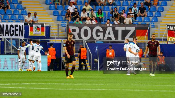 Cameron Archer of England celebrates after scoring his team's first goal with teammates during the UEFA Under-21 Euro 2023 group C match between...