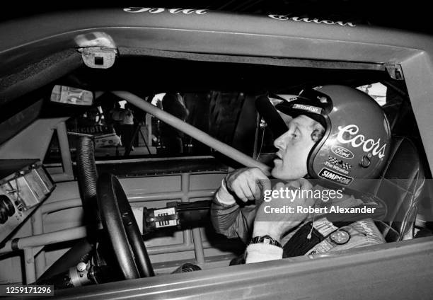 Driver Bill Elliott sits in his racecar prior to the start of the 1984 Daytona 500 stock car race at Daytona International Speedway in Daytona Beach,...