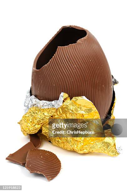 broken chocolate easter egg - easter egg stock pictures, royalty-free photos & images