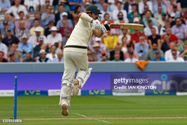 Australia's Travis Head plays a shot on day one of the second Ashes cricket Test match between England and Australia at Lord's cricket ground in...