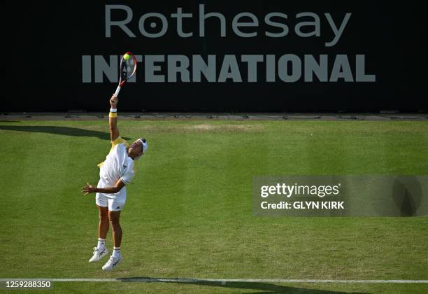 Argentina's Sebastian Baez serves to US player Tommy Paul during their men's singles round of 16 tennis match at the Rothesay Eastbourne...