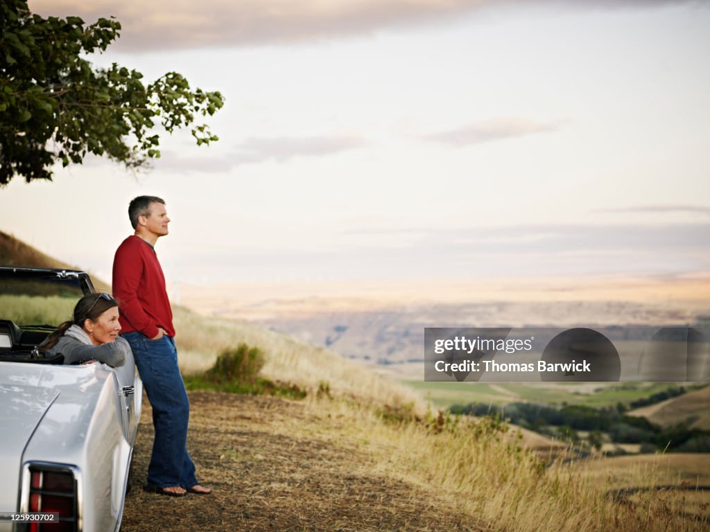 Mature couple watching sunset