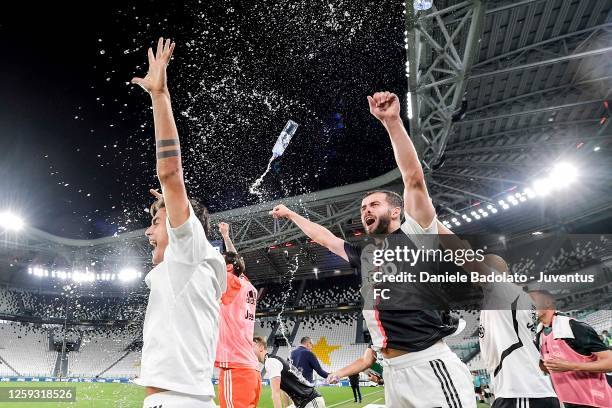 Paulo Dybala and Miralem Pjanic of Juventus celebrate after winning the Serie A championship match between Juventus and UC Sampdoria at Allianz...