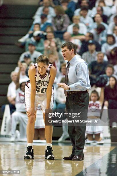 University of Connecticut coach Geno Auriemma strategizes with his star player Rebecca Lobo during a break in the action, in a basketball game at...