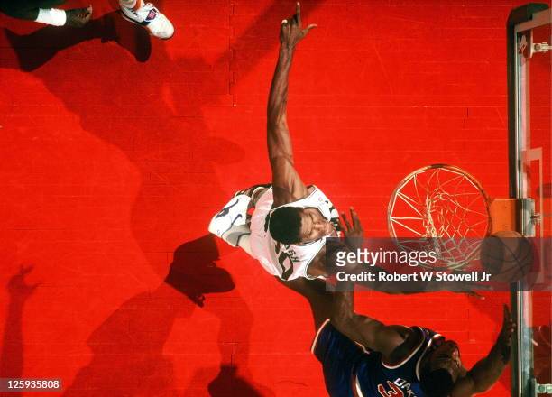 Aerial view showing Boston Celtics' center Robert Parish blocking a shot by the New York Knicks' Charles Oakley, during a game played in Hartford,...