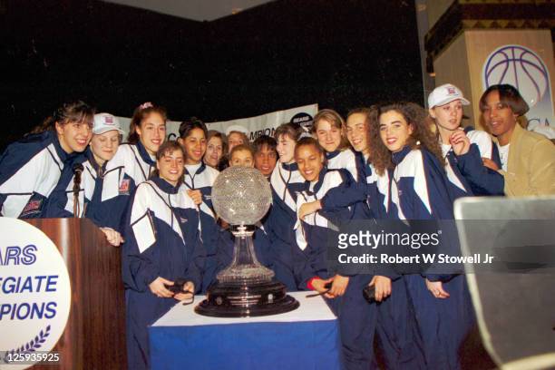 Group portrait of the University of Connecticut women's basketball team as they accept the Sears Trophy as the 1995 NCAA national champions,...