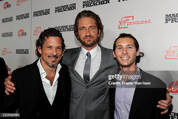 Virgin Produced's Rene Rigal, Actor/Executive Producer Gerard Butler and Virgin Produced's Justin Berfield arrive at the "Machine Gun Preacher" Los...