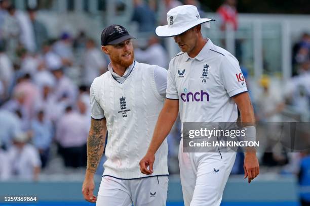 England's captain Ben Stokes and England's Stuart Broad leave the pitch at the end of play on day one of the second Ashes cricket Test match between...