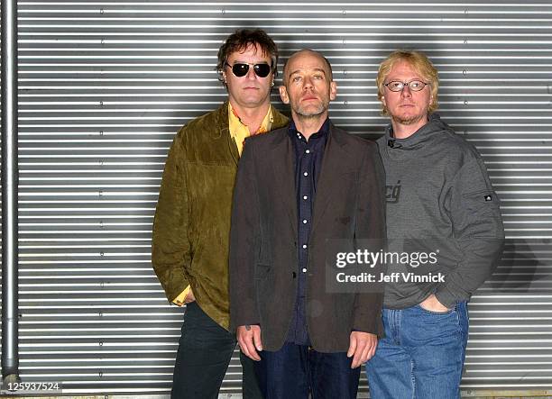 Peter Buck, Michael Stipe and Mike Mills of R.E.M. Pose for a band photo at Bryan Adam's recording studio March 5, 2007 in Vancouver, British...