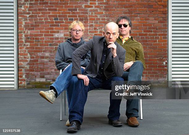 Mike Mills, Michael Stipe and Peter Buck of R.E.M. Pose for a band photo at Bryan Adam's recording studio March 5, 2007 in Vancouver, British...