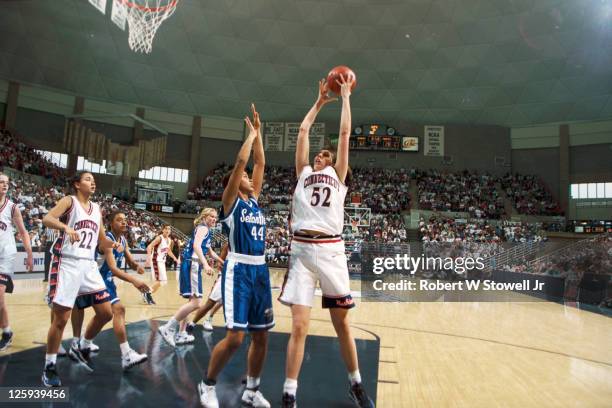 University of Connecticut player Kara Wolters clears the board and grabs a rebound during a game against Seton Hall, at Gampel Pavilion in Storrs,...