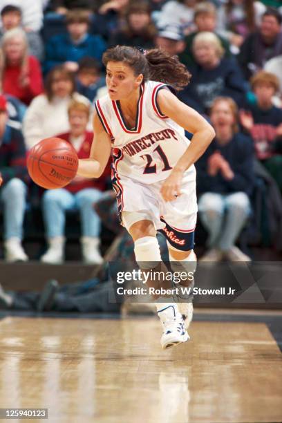 University of Connecticut player Jennifer Rizzotti runs the break and dribbles upcourt during a game at Gampel Pavilion in Storrs, CT, 1996.