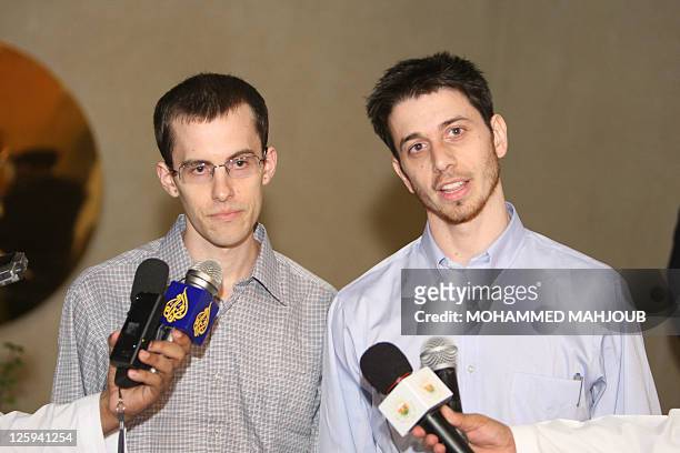 American hikers Shane Bauer and Josh Fattal hold a press conference after stepping off an Omani Royal Air Force plane on September 21, 2011 in...