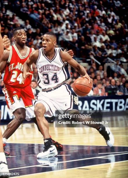 University of Connecticut star Ray Allen takes the ball to the hoop in a game pitting Connecticut against fellow Big East conference team St. John's,...