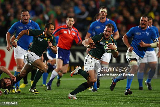 Francois Hougaard of South Africa breaks with the ball during the IRB 2011 Rugby World Cup Pool B match between South Africa and Namibia at North...