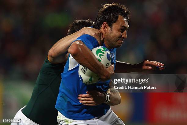 Danie van Wyk of Namibia is tackled during the IRB 2011 Rugby World Cup Pool B match between South Africa and Namibia at North Harbour Stadium on...