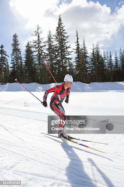 biathlon athlete quickly skis - biathlon ski stock pictures, royalty-free photos & images