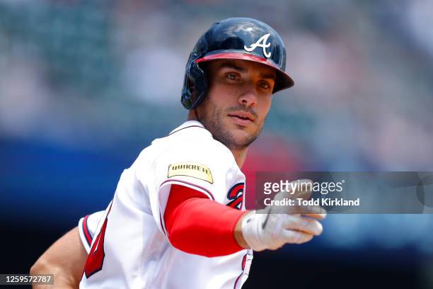Matt Olson of the Atlanta Braves reacts after hitting a solo home run during the eighth inning against the Minnesota Twins at Truist Park on June 28,...