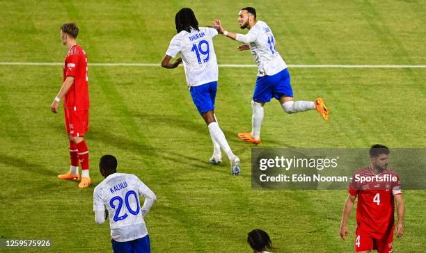 Amine Gouiri of France celebrates with teammate Khephren Thuram-Ulien after scoring his side's first goal during the UEFA Under-21 EURO 2023 Finals...