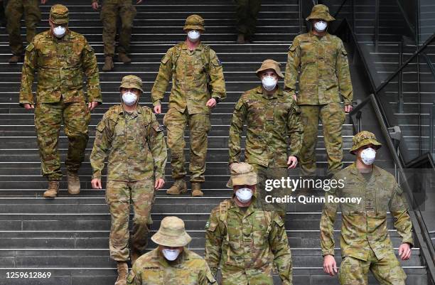 Members of the Australian Defence Force walk through the city on July 27, 2020 in Melbourne, Australia. Victoria has recorded 532 new cases of...