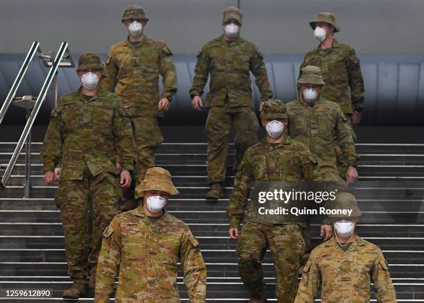 Members of the Australian Defence Force walk through the city on July 27, 2020 in Melbourne, Australia. Victoria has recorded 532 new cases of...