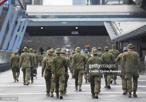 Members of the Australian Defence Force walk through the city on July 27, 2020 in Melbourne, Australia. Victoria has recorded 532 new cases of...