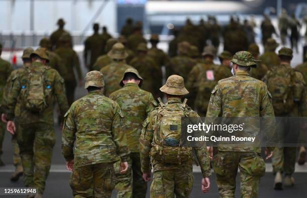 Members of the Australian Defence Force walk through the city on July 27, 2020 in Melbourne, Australia. Victoria has recorded 532 new cases of...