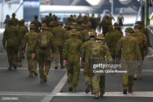 Members of the Australian Defence Force walk through the city on July 27, 2020 in Melbourne, Australia. Victoria has recorded 532 new cases of...