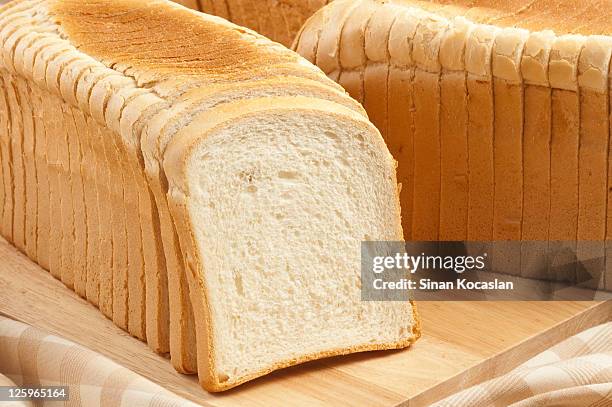 fette di pane tostato - loaf of bread foto e immagini stock