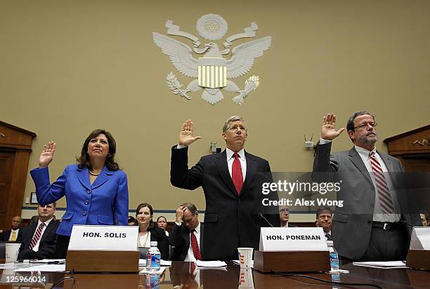 Labor Secretary Hilda Solis, Deputy Energy Secretary Daniel Poneman, and Commissioner of the Bureau of Labor Statistics Keith Hall are sworn in...