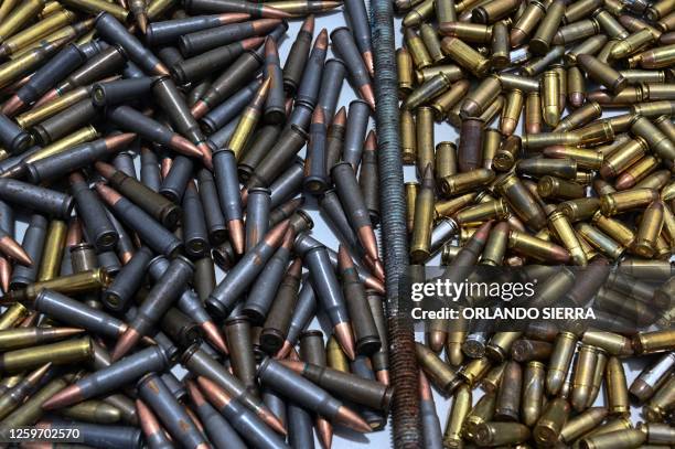 Picture of bullets seen as the Military Police of Public Order displays weapons, ammunition, drugs, mobile phones and other items seized to...