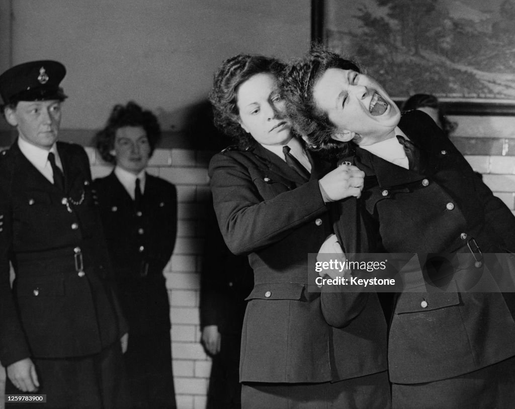 Female Police Officers Learning Ju Jitsu