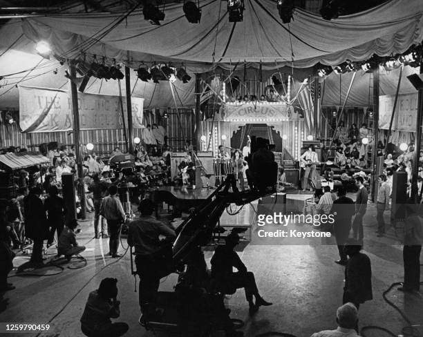 The Rolling Stones performing onstage inside a replica of a circus tent during the recording of 'The Rolling Stones Rock and Roll Circus' at Intertel...