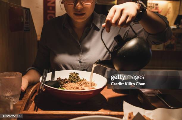 asian japanese ramen noodle - pouring sauce stock pictures, royalty-free photos & images