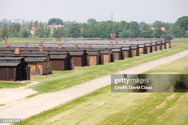 view from entrance watch tower looking towards prisoners barracks in birkenau, auschwitz concentration camp in poland - nazi concentration camp stock pictures, royalty-free photos & images